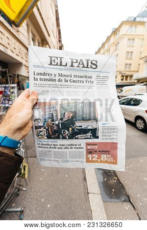 Paris, France - Mar 15, 2018: Male Hand Holding Spanish El Pais Newspaper With Portrait Of Stephen H