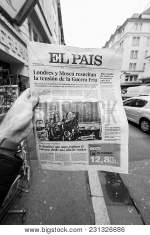 Paris, France - Mar 15, 2018: Male Hand Holding Spanish El Pais Newspaper With Portrait Of Stephen H