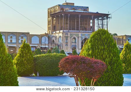 The Facade Of Medieval Qapu Palace And Its Large Summer Terrace With Lush Thujas And Trimmed Bushes 