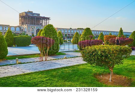 Isfahan, Iran - October 20, 2017: The Medieval Qapu Palace In Naqsh-e Jahan Square Is Seen Through T