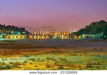 The Pleasant Evening Walk In Moshtagh-e Aval Park With A View On Dried Up Zayandeh River And  Arched