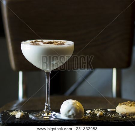 Milkshake In Stylish Glass With Ice Cream And Biscuits