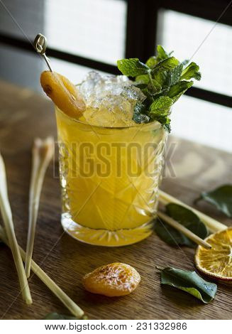 Orange Cocktail In A Beautiful Glass On A Wooden Table