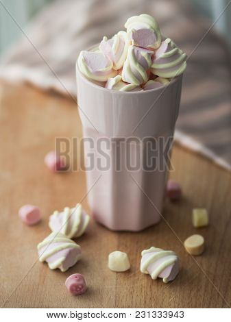 Marshmelow In A Nice Pink Glass On The Table