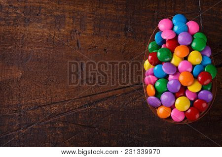 Chocolate Egg With Filling For Easter On Wooden Background