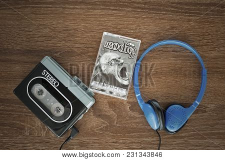 Vilnius, Lithuania - August 20, 2017: Vintage Walkman, The Prodigy Cassete And Headphones On The Woo