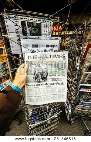 Paris, France - Mar 15, 2018: Hand Holding British Newspaper The Times With Portrait Of Stephen Hawk