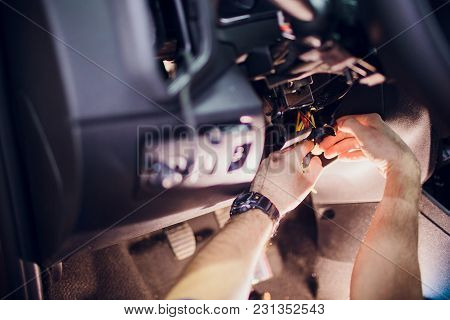 Keychain Car Security System. Installation In Car Man Hand