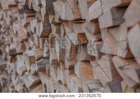 Material For Heating The House. Preparation Of Firewood For The Winter. Background Of Firewood. A Pi