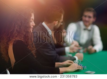luckiest woman on the background of the players in the casino.