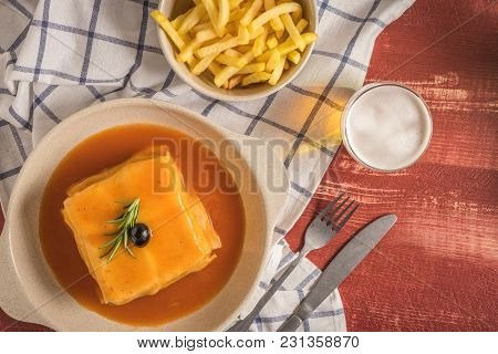 Traditional Portuguese Snack Food. Francesinha Sandwich Of Bread, Cheese, Pork, Ham, Sausages, With 