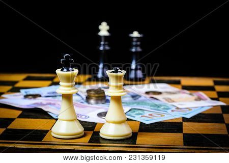 Chess Board With Cash And Chess On A Dark Background