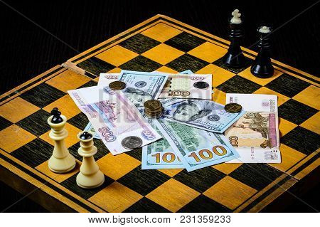 Chess Board With Cash And Chess On A Dark Background