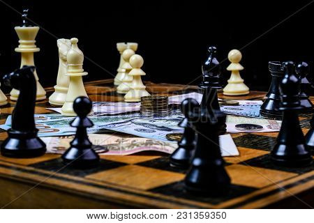 Chess Board With Cash And Chess On A Dark Background