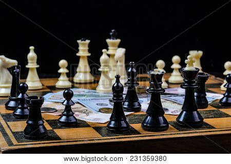 Chess Board With Cash And Chess On A Dark Background