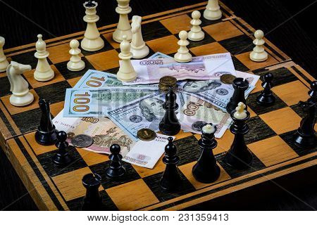 Chess Board With Cash And Chess On A Dark Background