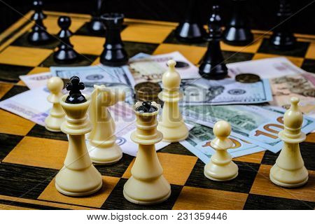 Chess Board With Cash And Chess On A Dark Background
