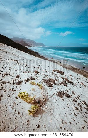 Remote Deserted Beach Praia Grande. Spectacular Sand Dunes, Ocean Waves And Black Volcanic Stones. B