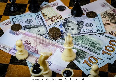 Chess Board With Cash And Chess On A Dark Background