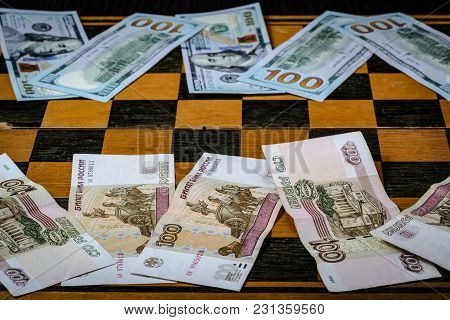 Chess Board With Cash And Chess On A Dark Background