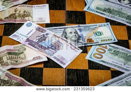 Chess Board With Cash And Chess On A Dark Background