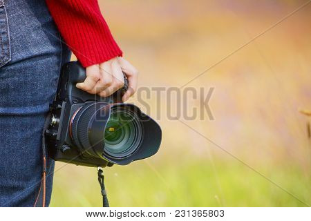 Hand Holding A Digital Camer With Copy Space To Add Text