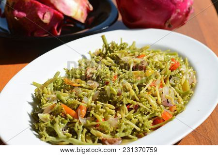 Spicy Carica Papaya Flowers Stir-fry. Javanese Traditional Food Called 
