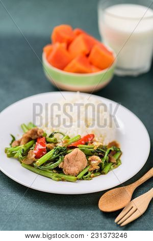 Thai Food, Stir Fried Morning Glory (pad Pak Boong) With Cooked Rice On Dish, Glass Of Milk And Piec