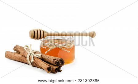 Honey Pot Cinnamon On An Isolated White Background, Rope. Copy Space, Template