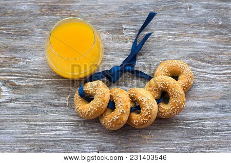 Traditional Greek Easter Biscuits Paskhalina Kuluria With Sesame Seeds On A Wooden Table, Selective 