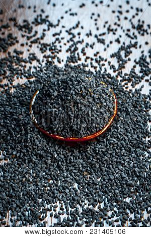 Close Up Of An Essential Beneficial Ayurvedic Herb I.e Kalonji Or Black Caraway In A Wooden Plate On