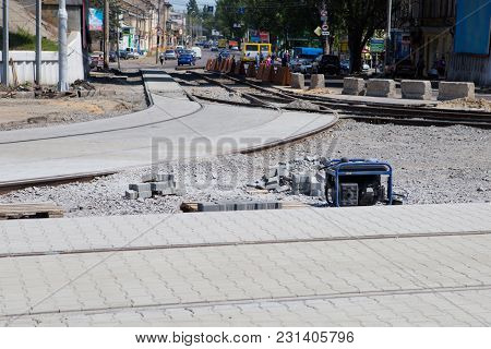 Paving Stones On City Street. Tram Rails Repair. City Road Closed. Road Repair Process. Road Mainten