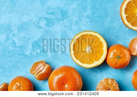 Variety Of Fresh Citrus For Making Juice Or Smoothie Over Blue Textured Background, Topview, Selecti