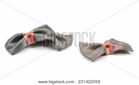 Farfalle Pasta With Black Cuttlefish Ink Isolated On White Background Three Raw Pieces Classic Tradi