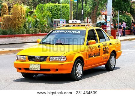Oaxaca, Mexico - May 25, 2017: Taxi Car Nissan Tsuru In The City Street.