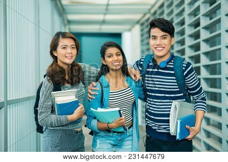 Group Of Happy College Students With Books And Textbooks