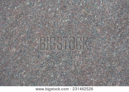 Unpolished Surface Of Greyish Pink Granite Stone