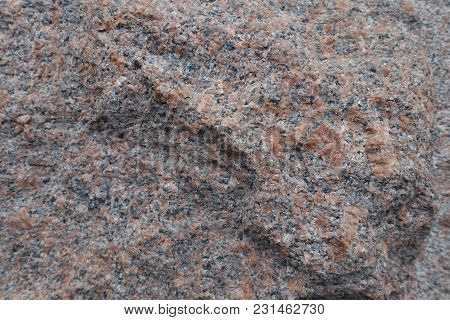 Unwrought Rough Surface Of Pink Granite Stone