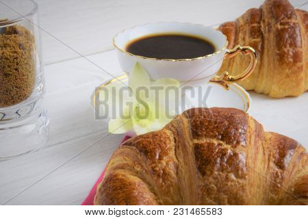 Vintage Coffee Cup With Espresso On A Saucer, Croissant On The Rose Table-napkin And Some Biscuits ,