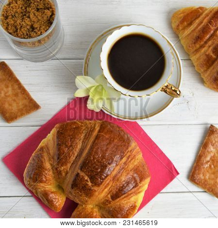 Vintage Coffee Cup With Espresso On A Saucer, Croissant On The Rose Table-napkin And Some Biscuits ,