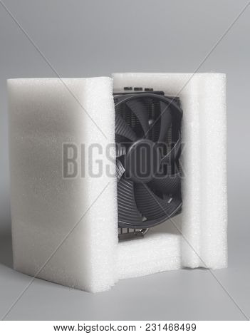 New Computer Fan Processor Cooler With Foam Polystyrene On Gray