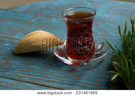 National Azerbaijan Pastry Shekerbura With Nuts And Honey And Glass Of Black Tea On Wooden Table Wit