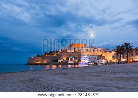 Peniscola, Spain - May 2017: Moonlit Beach In Front Of Peniscola Old Town, Evening View