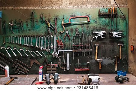 Wall With Different Metal Instruments In Little Factory Room