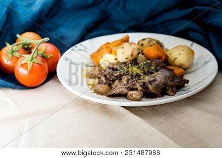 Beef meat stewed with potatoes-Traditional French cuisine Beef Bourguignon potatoes carrots in persillade