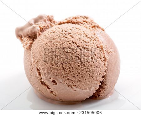 Lightly Melted Chocolate Ice Cream Scoop On White Plate Close-up