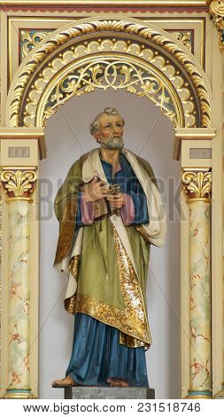 SISAK, CROATIA - DECEMBER 07: Statue of Saint Peter on the main altar in the Church of Holy Cross in Sisak, Croatia, on December 07, 2017.