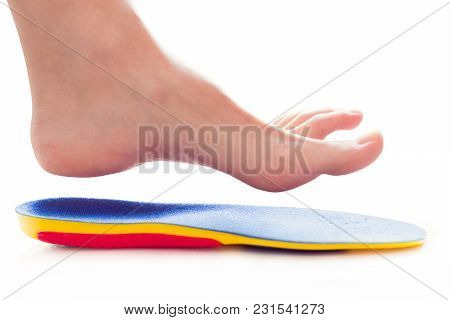 Orthopedic Insole And Female Leg Above It