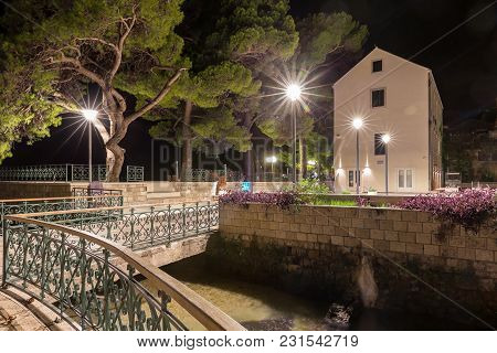 Bridge, Oil Mills And Old Platan In Night With Blue Illuminations. Mlini. Croatia