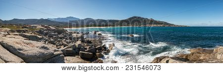 Waves Washing Onto Rocks Near Algajola Beach In Corsica